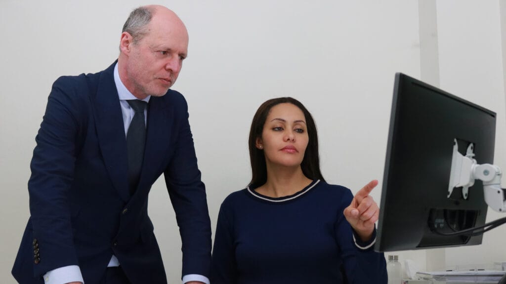 Professors Schilders and Johnson working in a state-of-the-art clinic, offering advanced care for sports injuries.